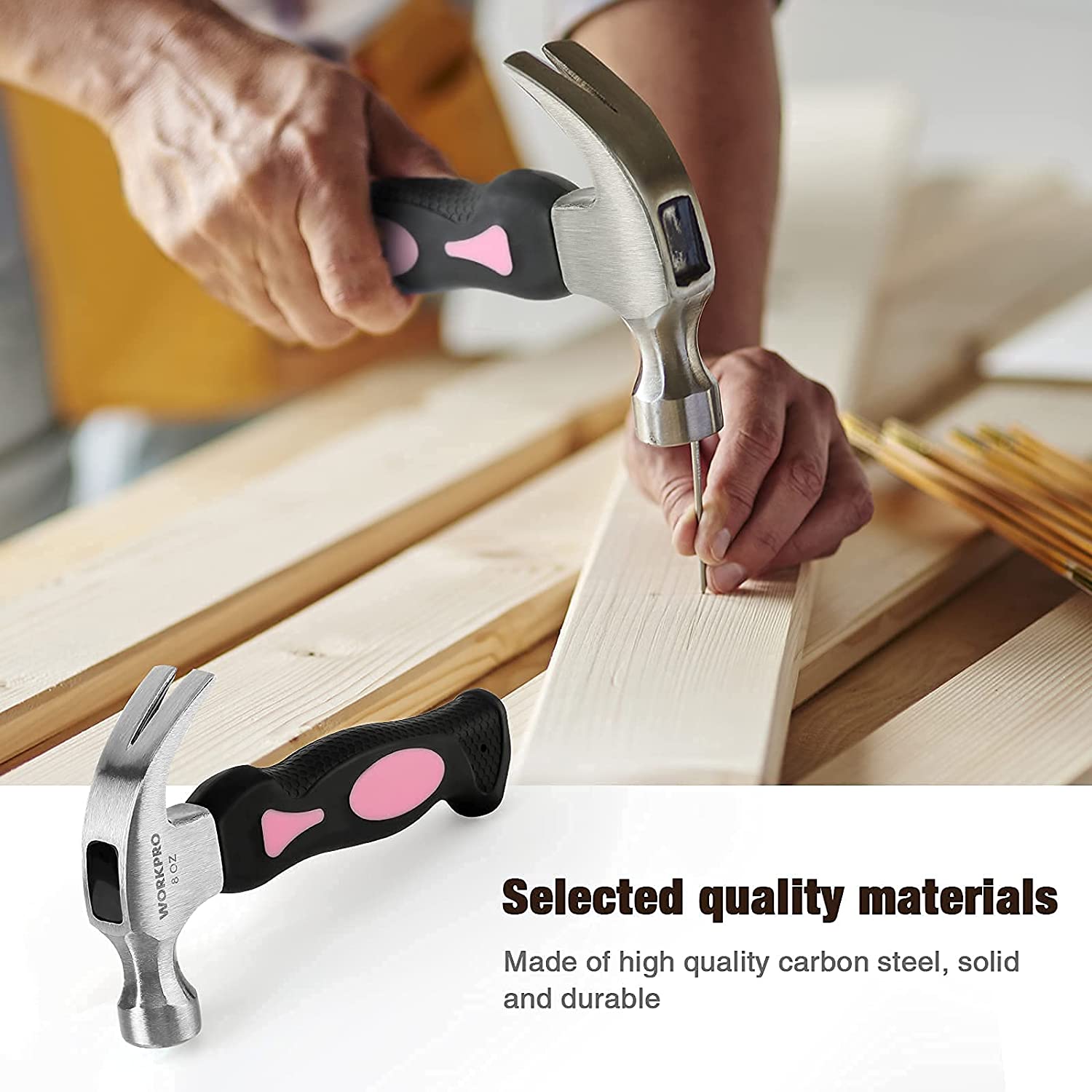 Pink and black hammer tools and adjustable wrench on wood surface, hands holding tool