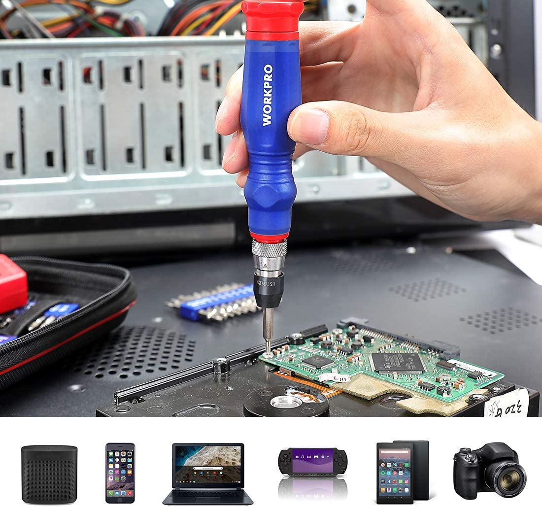 Precision screwdriver in hand for electronics repair on an open circuit device