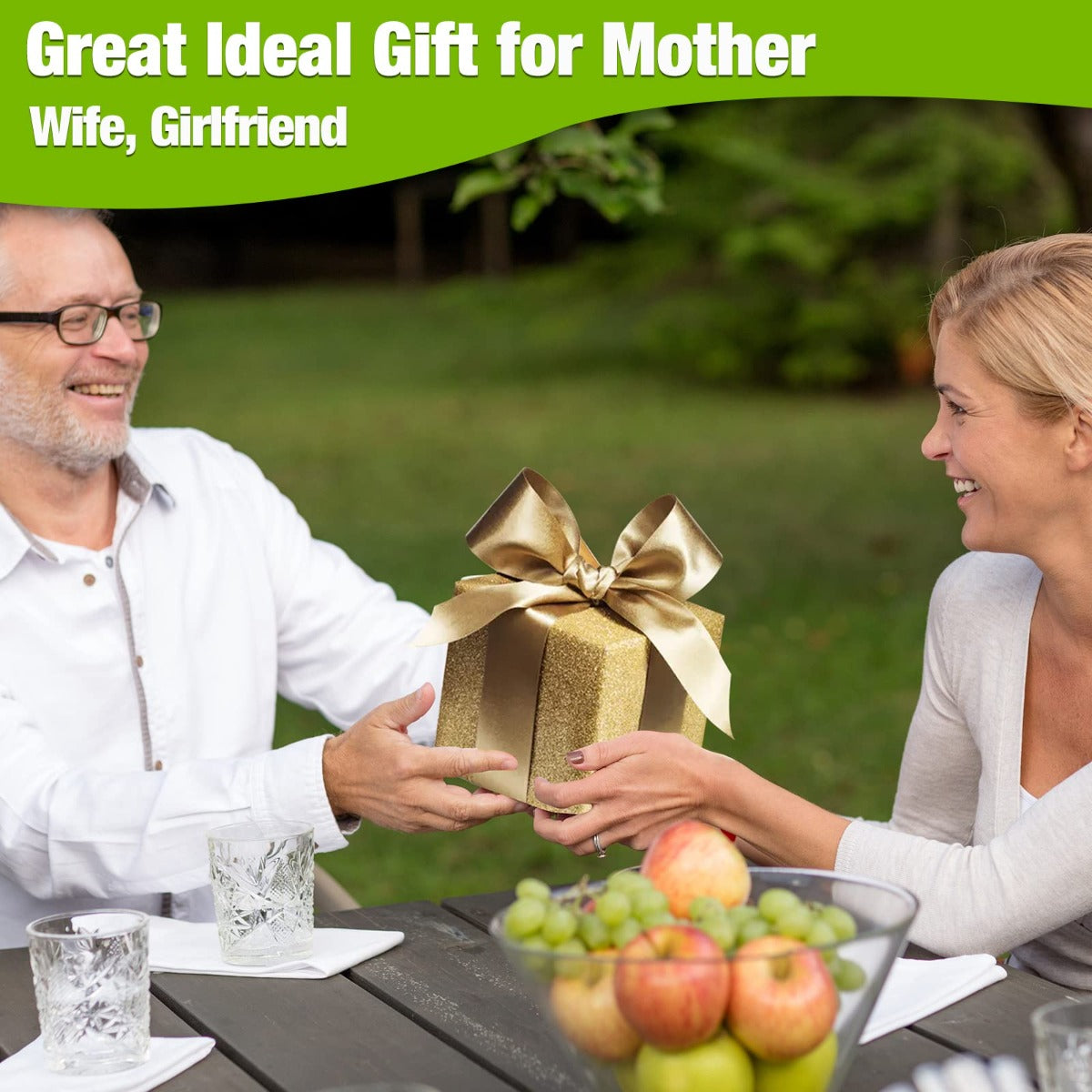 Gift box with gold ribbon held on a table; grass trimmer not visible