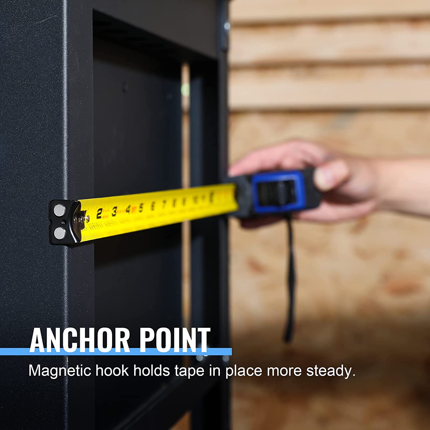 Auto-lock tape measure end with metal hook attached to a dark surface