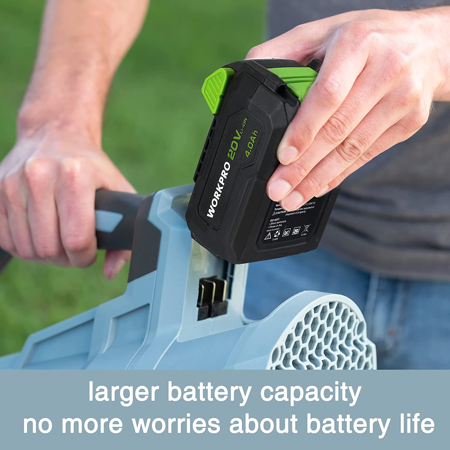 Cordless leaf blower with black handle, green battery pack installed on light blue unit