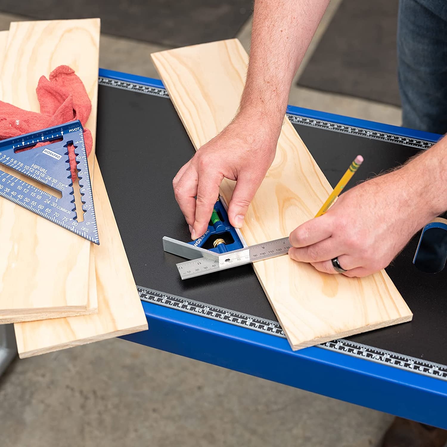 Combination square tool with scriber and level used to mark cuts on wooden boards