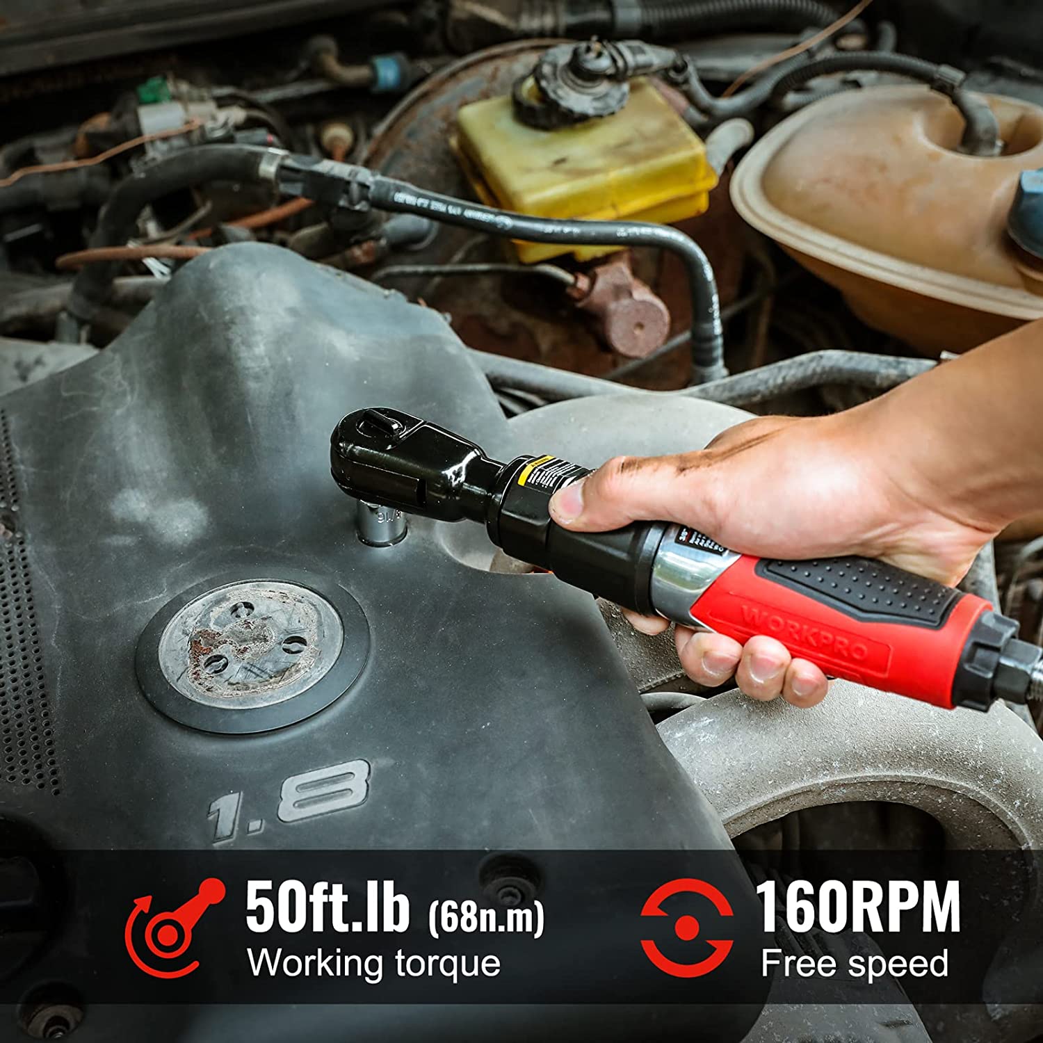 WORKPRO pneumatic air ratchet wrench with red grip being held for fastening