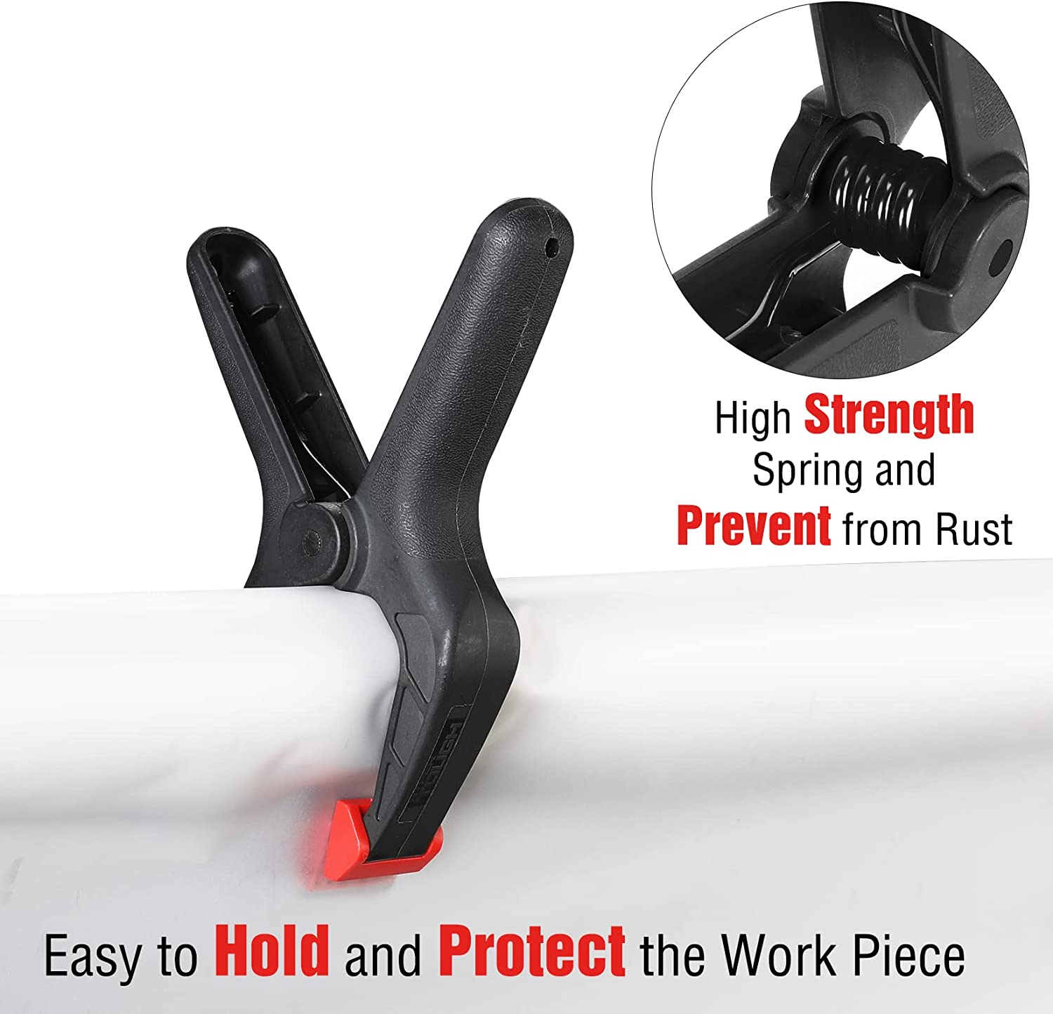 Black spring clamp with red protective jaw pad securing a white workpiece