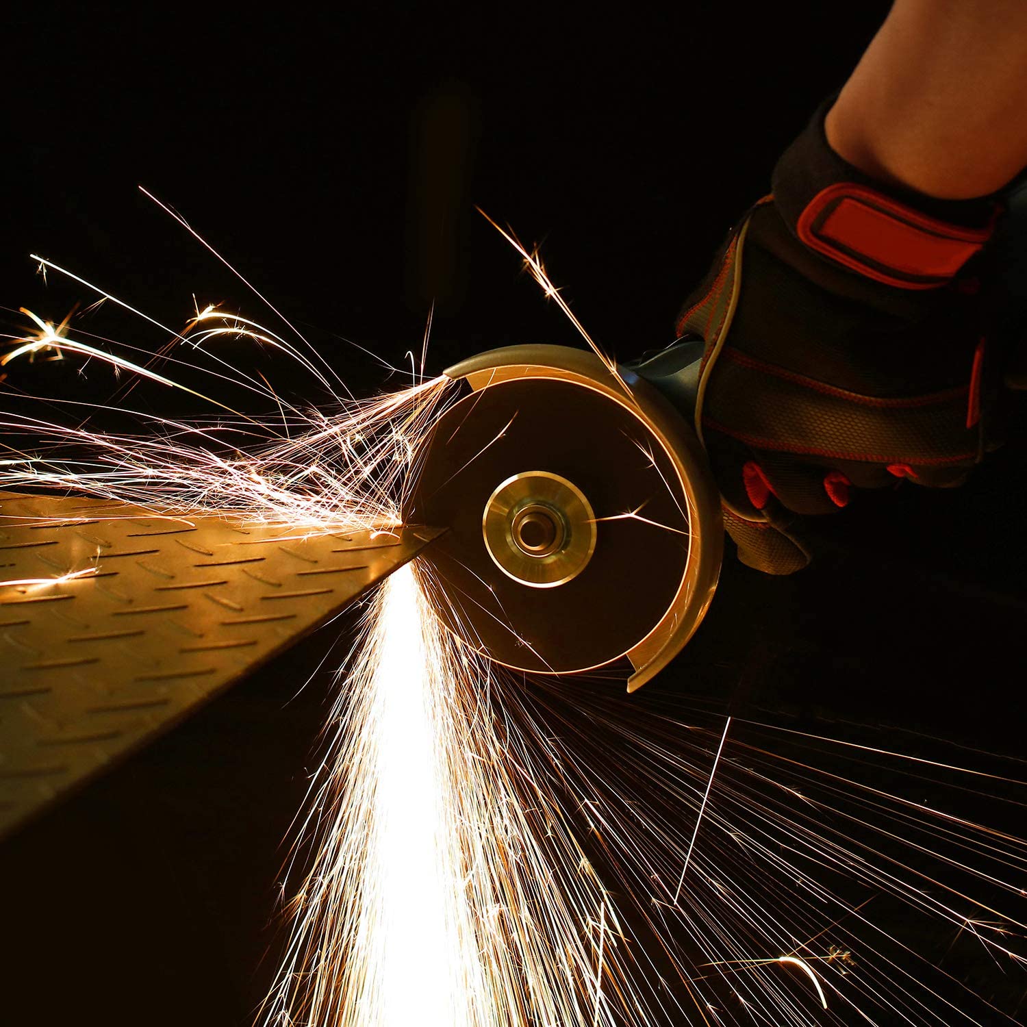Angle grinder cut-off wheel cutting metal with bright sparks