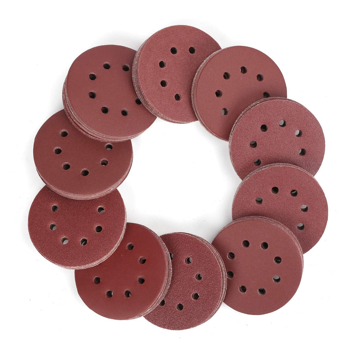 Round red sanding discs with dark perforations, stacked in a ring