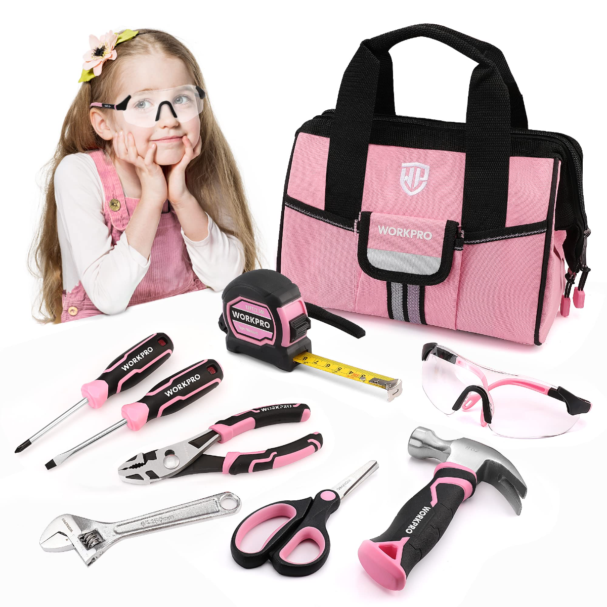 Pink kids tool bag with handle and assorted hand tools, including safety goggles and tape