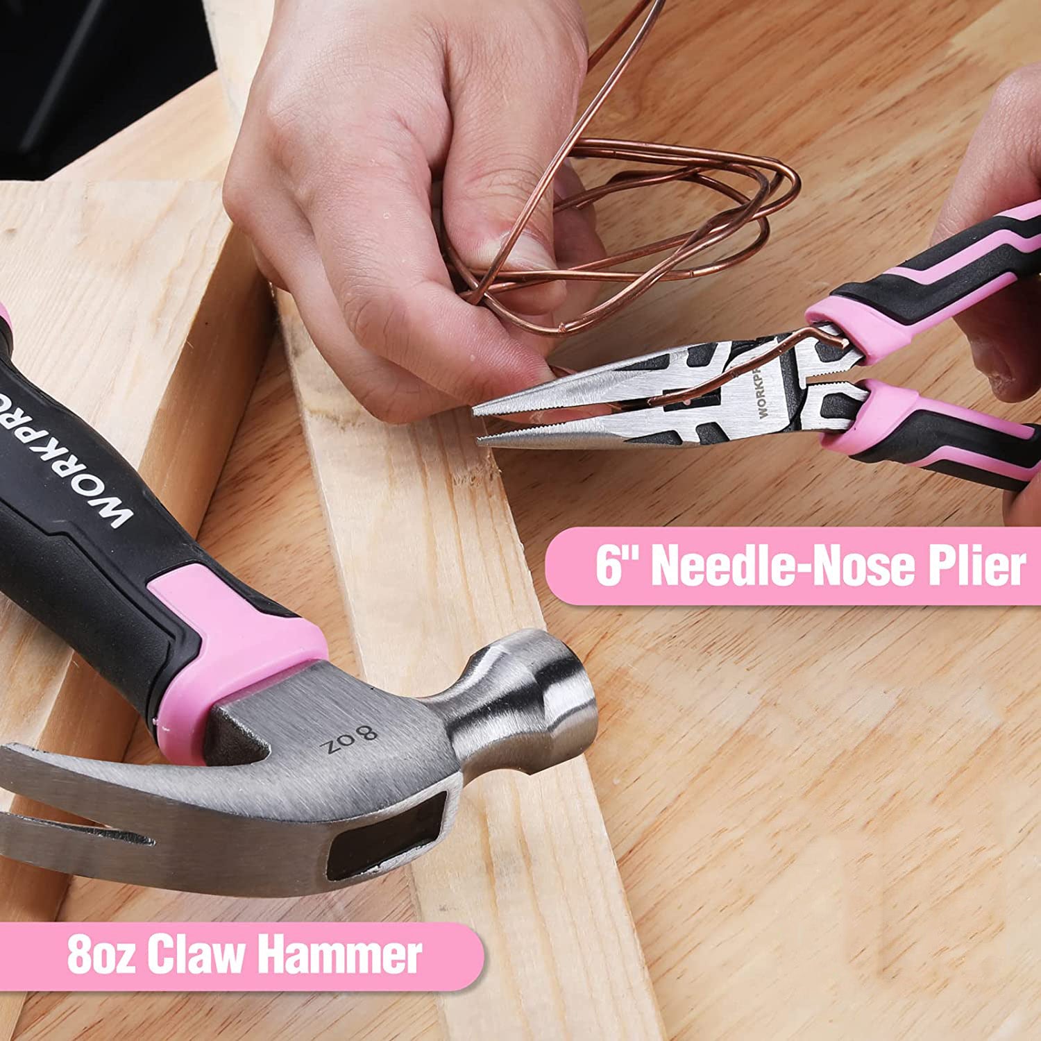 Pink needle-nose pliers and pink-and-silver claw hammer on wooden board