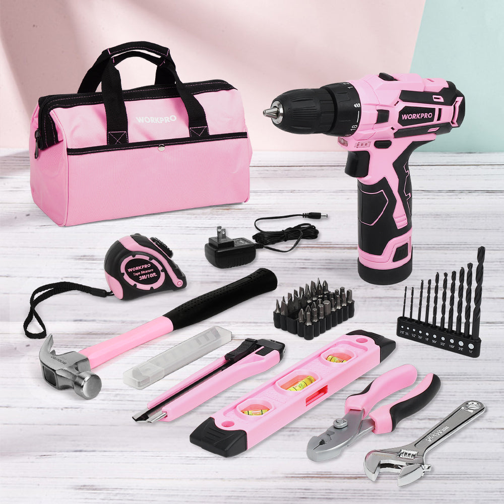 Pink storage bag with cordless drill, charger, tape measure, and assorted hand tools and bits