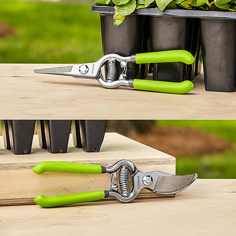 Pruning shears set resting on wood: green handles, straight steel blades, coil spring