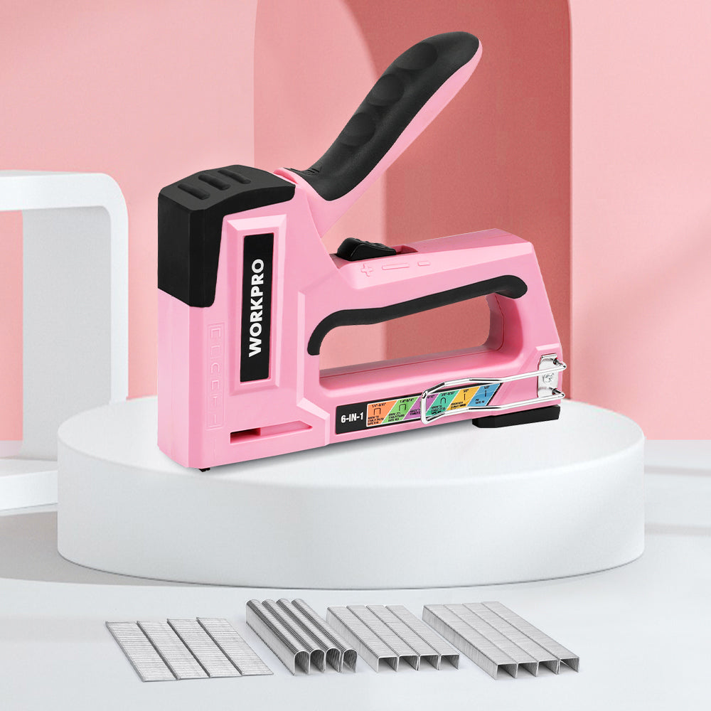 Pink manual brad stapler with black grip, front loading area, and 6-in-1 design