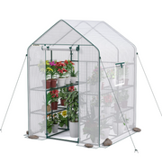 Portable walk-in greenhouse with zipped mesh panels and roll-up door, potted plants