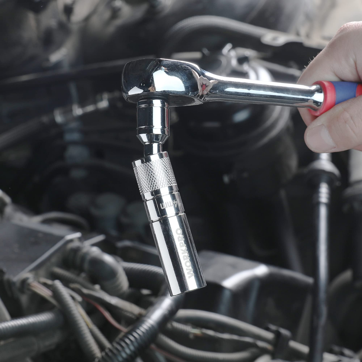 Chrome-silver magnetic swivel spark plug socket attached to a wrench extension