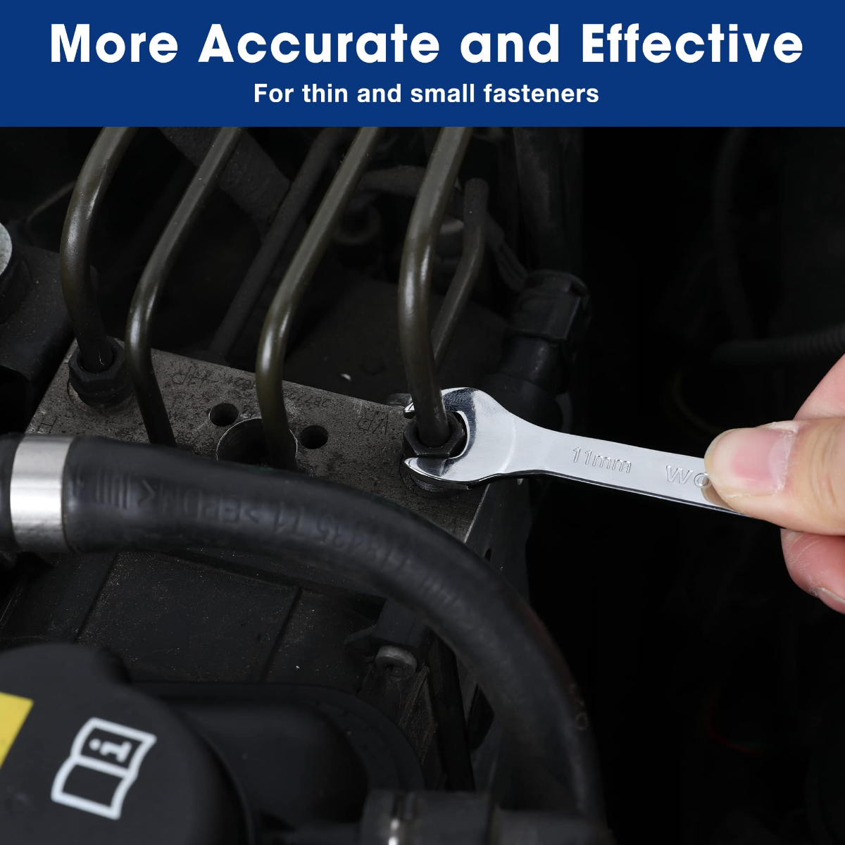 Metric open-end wrench tightening a small fastener in a narrow engine space
